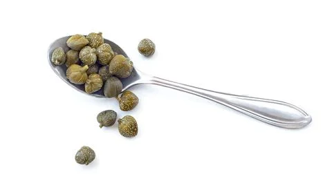 Capers in spoon isolated 스톡 사진
