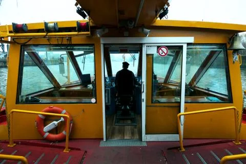 Capitan of river boat at work Stock Photos