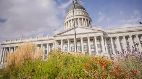 Capitol Building camera movement to focus on American flag waving in the wind Video stock 32287149