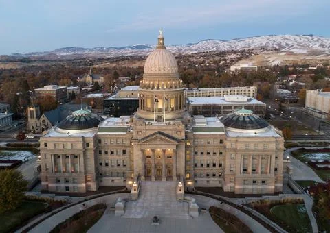 The Capitol building is a large, ornate structure with a dome on top Stock Photos