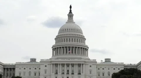 Capitol Hill in Washington DC with US Flag Blowing in the Wind Stock Footage 22252534