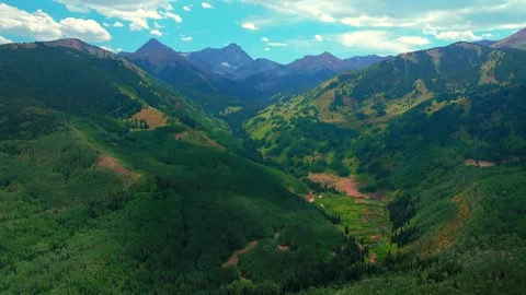 Capitol Peak Wilderness spring summer aerial drone parallax Colorado Aspen Video stock 316576945