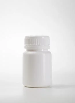 Caplets and bottle with blank label Stock Photos
