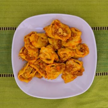 Cappellacci with ragù Stock Photos