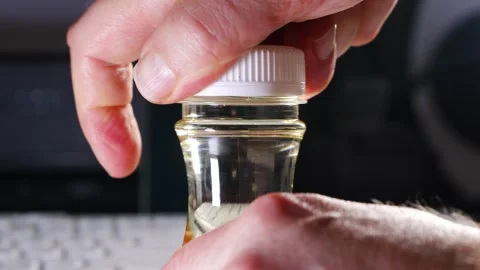 Capping aroma diffuser liquid in glass bottle Video stock 336557674