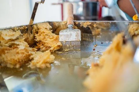 Capping Scratcher in a Metal Decapping Tray with Beewax and Honey During Be.. Stock Photos