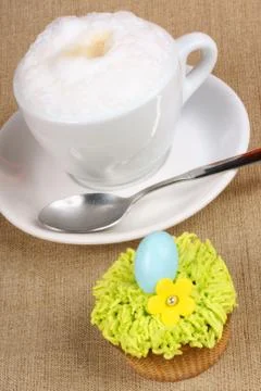 Cappuccino and easter cupcake Stock Photos