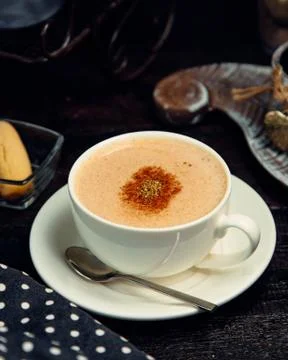 Cappuccino with cinnamon on the table Stock Photos