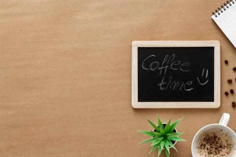 Cappuccino coffee on a brown empty background. View from above. Copy space Stock Photos