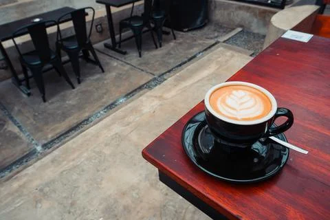 Cappuccino on the corner of the table with copy space Stock Photos