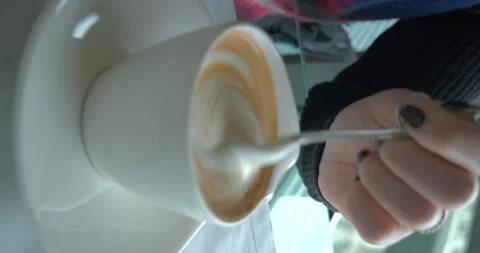 Cappuccino cup in front of window, vertical 4K Stock-Footage 235356972