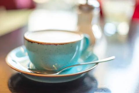 Cappuccino in a cup on the table. selective focus Stock Photos