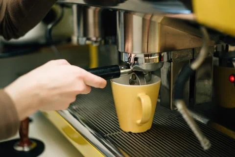 Cappuccino machine pouring coffee Stock Photos