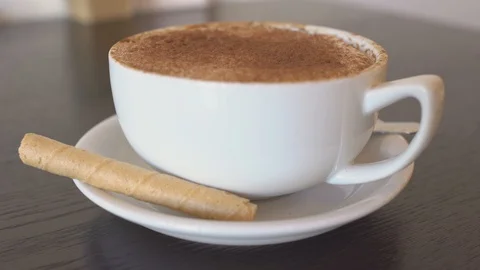 Cappuccino on a table, 4k Stock Footage 101895353