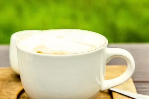 A cappuccino on the table with nature background Stock-Fotos