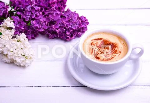 Cappuccino in a white cup and saucer Stock Photos