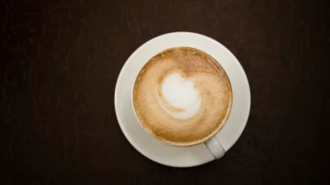 Cappuccino in a white cup Stock Photos