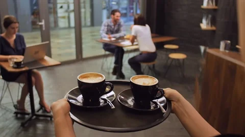 Cappuccinos on a tray Stock Footage 58202536