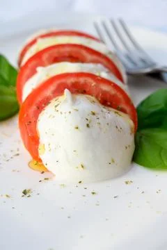 Caprese salad made with fresh soft white italian cheese mozzarella buffalo, g Stock Photos