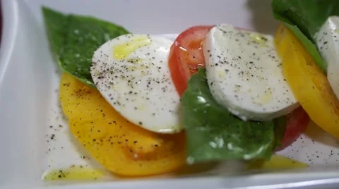 Caprese Salad - Mozzarella, Basil, Red Tomato and Yellow Tomato Stock Footage 40214902