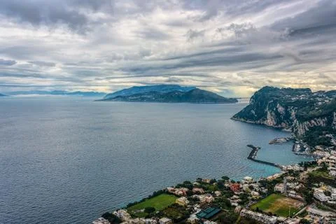 Capri Island view under cloudy sky after storm Stock Photos