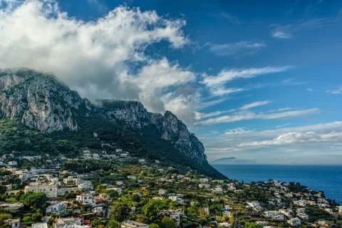 Capri Island view under cloudy sky after storm Stock Photos