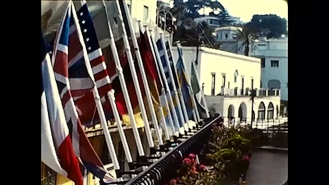 Capri, Italy, 1985 - Flags of different nations fly on the terrace of a hotel Stock-Footage 167088895
