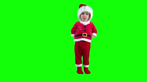 Capricious child boy take of Santa hat and throw on ground. Green chroma key Stock Footage 201850413