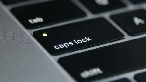 The Caps Lock Button on laptop keyboard, close-up. To press button with a pen Stock Footage 170158713