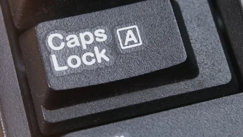 Caps Lock Key on Desktop Keyboard Pressed by Finger Hand Multiple Times Stock Footage 290469524