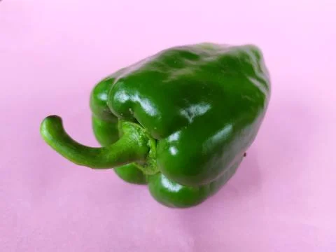 Capsicum green on colour background Stock Photos