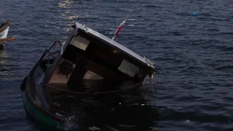 Capsized Boat after the Storm Stock Footage 314239278