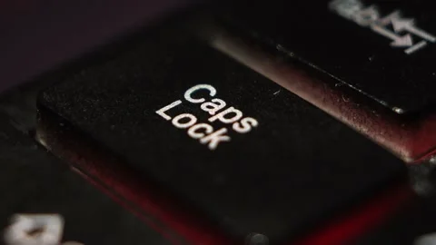 CapsLock button macro shooting the led light blue and red buttons keyboard Stock Footage 130205183