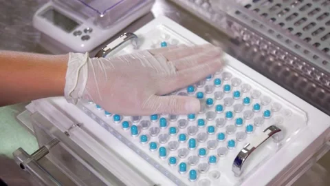 Capsule filling manual machine - dropping capsules Stock Footage 157233214
