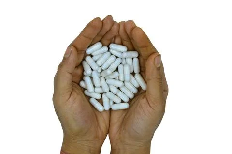 Capsule on hand Stock Photos