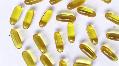 Capsule of omega 3, 6, 9 fish oil, vitamin, food supplements Stock Footage 328571760