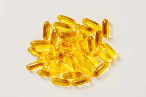 Capsule of omega 3, 6, 9 fish oil, vitamin isolated on white background. Stock Photos