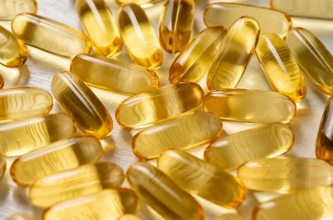 Capsule of omega 3, 6, 9 fish oil, vitamin isolated on white background. Stock Photos