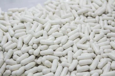 Capsule production process in factory. Foto stock