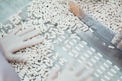 Capsule production process in factory. Foto stock