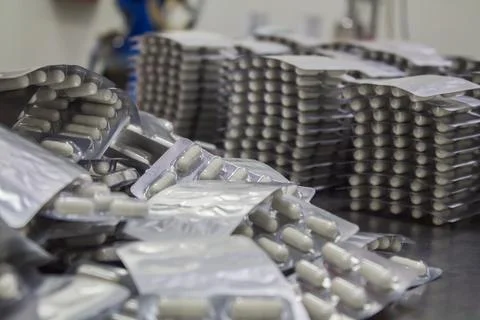 Capsule production process in factory. Foto stock