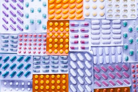 Capsules and tablets in blisters Stock Photos