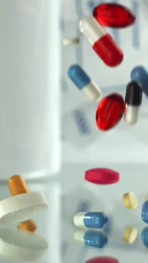 Capsules and tablets on laboratory scale Filmed on a high-speed camera at 1000 Stock Footage 335396224