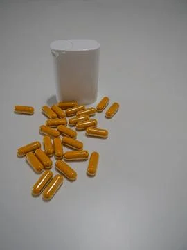 Capsules and White Container Stock Photos