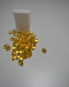 Capsules and White Container Stock Photos