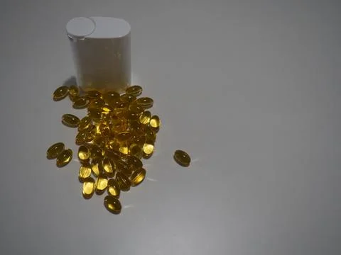 Capsules and White Container Stock Photos