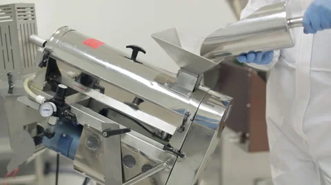 Capsules being Poured into a Pill Sorting Machine Stock Footage 68641918