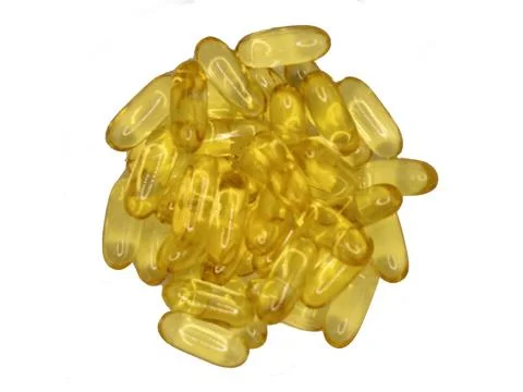 Capsules of cod liver oil Stock Photos