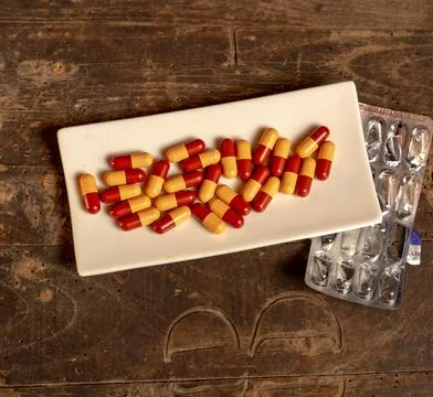 Capsules in the dish Stock Photos