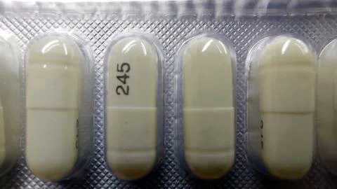 Capsules Displayed in a Blister Pack Showcasing Pharmaceutical Details and .. Stock Photos